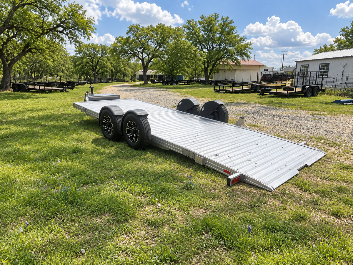 Timpte aluminum lowering deck trailer in a green spring yard — edited photo
